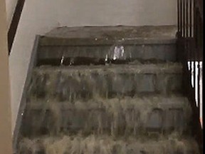 Water rushes down the stairs at the Westin Habour Castle hotel in Toronto after a pipe broke early Tuesday, Oct. 20, 2015. (Screenshot via twitter.com/richymiddleton)