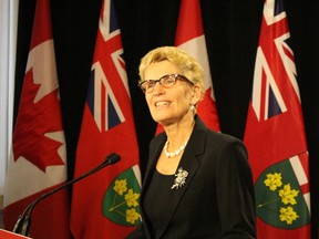 Premier Kathleen Wynne addresses the media about the federal Liberal victory on Oct. 20, 2015. (ANTONELLA ARTUSO/Toronto Sun)