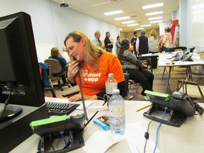 Katelynn Fleming works the phone at Sarnia-Lambton NDP candidate Jason McMichael's headquarters early on election night on Monday October 19, 2015 in Sarnia, Ont. (Paul Morden, The Observer)