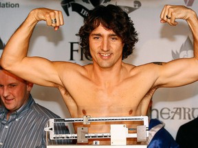 Justin Trudeau gestures while weighing-in for a charity boxing match in Ottawa in this March 28, 2012 file photo. REUTERS/Chris Wattie/Files