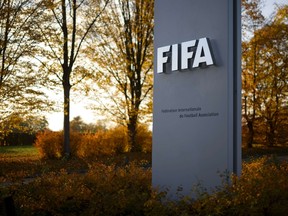The FIFA sign is seen at the entrance of world football's governing body headquarters in Zurich on October 20, 2015. FIFA's reform committee on October 20 issued an interim report calling for "significant changes" to its structure and operations in order to restore the reputation of world football's governing body.  (AFP/FABRICE COFFRINI)