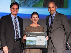 Sandra de Jong, a resident of Plympton-Wyoming, received this year's Canadian Wind Energy Association Friend of Wind Award. Making the presentation during the association's recent conference in Toronto are, left, association president Robert Hornung and board chairperson Ben Greenhouse. (Handout)