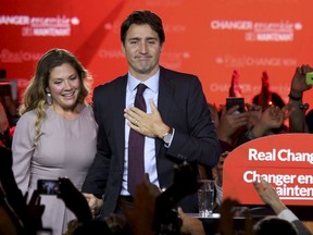 Liberal Party leader Justin Trudeau stands with his wife Sophie Gregoire as he gives his victory speech after Canada's federal election in Montreal, Quebec, October 19, 2015. REUTERS/Chris Wattie