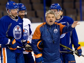 Todd McLellan forcibly reinforces a point in practice Tuesday. The Oilers head coach says players had to be reminded that they can't feel too comfortable. (David Bloom, Edmonton Sun)