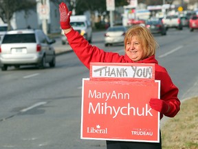 Kildonan St. Paul Liberal MP elect MaryAnn Mihychuk waves to motorists on Main Street in Winnipeg, Man. Tuesday October 20, 2015 following her win in Monday's federal election.
