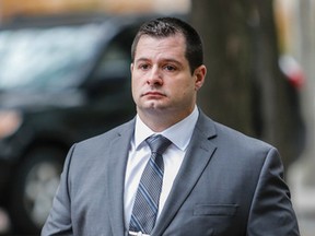 Toronto Police Const. James Forcillo enters University Ave. courthouse in Toronto for his second-degree murder trial on Tuesday, October 20, 2015. (Dave Thomas/Toronto Sun)