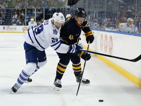 Toronto Maple Leafs right wing Brad Boyes and Buffalo Sabres centre Jack Eichel  go after a loose puck during a pre-season game. (Kevin Hoffman-USA TODAY Sports)
