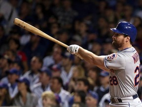 Daniel Murphy of the New York Mets hits a solo home run in the third inning against Kyle Hendricks of the Chicago Cubs during Game 3 of the National League Championship Series at Wrigley Field in Chicago on Oct. 20, 2015. (Jonathan Daniel/Getty Images/AFP)