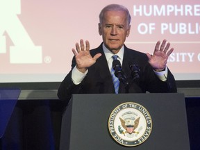 U.S. Vice President Joe Biden gestures as he speaks during an event honouring former U.S. Vice President Walter Mondale hosted by the Humphrey School of Public Affairs at the University of Minnesota in Washington on Oct. 20, 2015. (REUTERS/Joshua Roberts)