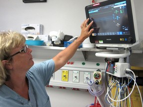 Registered nurse Tina Mapletoft demonstrates some of the features on one of the five new bedside patient monitors that have been purchased by the Foundation of Chatham-Kent Health Alliance for the emergency department at the CKHA Sydenham campus in Wallaceburg, Ont. (Handout)