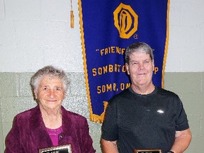 Submitted Photo: Elise Krahn and Don Wells with their Optimist awards that recognize their years of community involvement