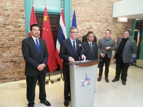 Mayor Jim Watson, flanked by the ambassadors of China and Thailand,  announced on Wednesday, October 21, 2015, that he will lead an economic mission to Beijing and Bangkok next month. (JON WILLING Ottawa Sun)