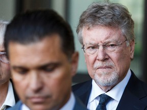 Richard Suter is seen while lawyer Dino Bottos speaks to the media outside of Court of Queen's Bench in Edmonton, Alta., on Friday June 5, 2015 after Suter pleaded guilty to the charge of refusing to provide a breath sample related to the death of Geo Mounsef, 2. Ian Kucerak/Edmonton Sun