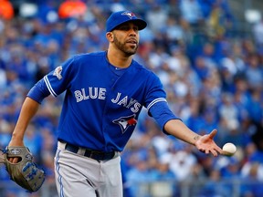David Price #14 of the Toronto Blue Jays throws to first base to force out Alcides Escobar #2 of the Kansas City Royals in the third inning in game two of the American League Championship Series at Kauffman Stadium on October 17, 2015 in Kansas City, Missouri. (Jamie Squire/Getty Images/AFP)