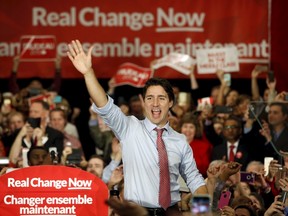 Liberal leader and Prime Minister-designate Justin Trudeau waves to supporters at a rally in Ottawa, on Oct. 20, 2015. (REUTERS/Patrick Doyle)