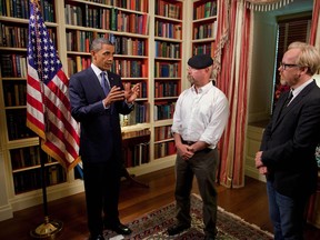 President Barack Obama records an episode of the Discovery Channel's television show Mythbusters with co-hosts Jamie Hyneman and Adam Savage in the Library of the White House, July 27, 2010. (Handout)