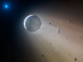 This artist's rendering provided by the Harvard-Smithsonian Center for Astrophysics shows an asteroid slowly disintegrating as it orbits a white dwarf star. (Mark A. Garlick/Harvard-Smithsonian Center for Astrophysics via AP)