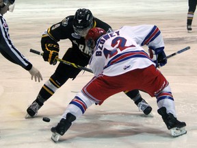Sarnia Sting centre Troy Lajeunesse faces off with Mark Bzowey of the Kitchener Rangers during an Ontario Hockey League game in Sarnia Jan. 15, 2015. The clubs will face off for the first time this season when the Sting host the Rangers at 7:05 p.m. Thursday.  (Terry Bridge/Sarnia Observer/Postmedia Network)