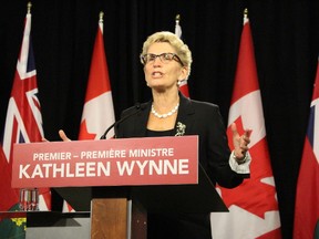 Ontario Premier Kathleen Wynne speaks to the media on Tuesday October 20, 2015. (Antonella Artuso/Toronto Sun)