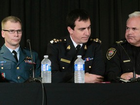 Mayor Jim Watson along with Major General Coates, RCMP National Division Commanding Officer Gilles Michaud and Ottawa Police Chief Charles Bordeleau held a press conference was held at the RCMP National Division in Ottawa Wednesday Oct 22,  2014. Tony Caldwell/Ottawa Sun files