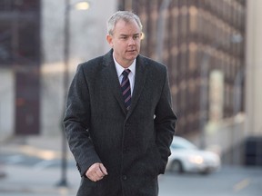 Dennis Oland heads to the Law Courts as his murder trial continues in Saint John, N.B., on Wednesday, October 21, 2015. (THE CANADIAN PRESS/Andrew Vaughan)