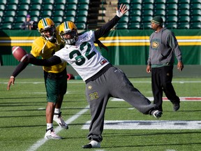 Eskimos receiver James Franklin and kick returner Kendial Lawrence bring a little levity to practice at Commonwealth Stadium Wednesday. (David Bloom, Edmonton Sun)