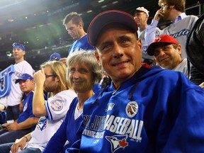 Frank and Cheryl Egan in their seats behind home plate take in action between the Toronto Blue Jays and the Kansas City Royals during game 5 of the American League Championship Series at the Rogers Centre in Toronto Wednesday October 21, 2015. (Dave Abel/Toronto Sun)