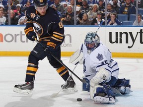 Maple Leafs goaltender Jonathan Bernier makes a save in front of the Sabres Jamie McGinn in Buffalo on Wednesday night. (Getty Images/AFP)