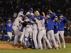 The New York Mets celebrate after Game 4 of the National League baseball championship series against the Chicago Cubs Wednesday, Oct. 21, 2015, in Chicago. The Mets won 8-3 to advance to the World Series. (AP Photo/Nam Y. Huh)