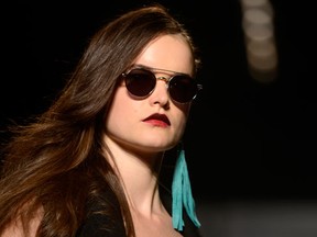 A model walks the runway in the Mackage show, part of Fashion Week in Toronto on Wednesday October 21, 2015. (THE CANADIAN PRESS/Marta Iwanek)