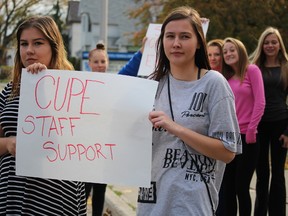 Grade 11 students Olivia Forestell and Desteny Turner protest outside of Sarnia Collegiate Institute & Technical School on Thursday October 22, 2015 in Sarnia, Ont. About 60 students walked out of class to draw attention to the lack of cleanliness in their school due to work-to-rule job action taken by support staff represented by the Canadian Union of Public Employees. The union is currently at loggerheads with the Ontario government over a new contract. (Barbara Simpson, The Observer)