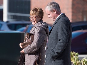 Dennis Oland and his mother Constance Oland head from the Law Courts as his murder trial continues in Saint John on Wednesday, October 21, 2015. (THE CANADIAN PRESS/Andrew Vaughan)