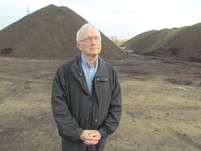 Frank Velle, waste reduction accounts supervisor with Sarnia's engineering department, stands near piles of compost at the city's compost site on St. Andrew Street on Thursday October 22, 2015 in Sarnia, Ont. A popular composting program has helped Sarnia boost its waste diversion rate over the last several years. (Paul Morden/Sarnia Observer/Postmedia Network)