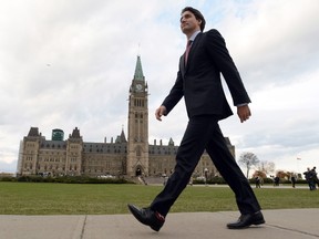 Prime minister designate Justin Trudeau makes his way from Parliament Hill to the National Press Theatre to hold a press conference in Ottawa on Tuesday, October 20, 2015. THE CANADIAN PRESS/Sean Kilpatrick