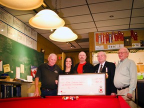 Alf Neuberger, Mary Yanke, Grahamn Scherger, Bill Skelly and Bob Neish stand at the end of the newly covered pool table in the Pincher Creek Legion on Oct. 15, 2015. Shell donated $1,500 for the refurbishment in recognition of volunteer work. John Stoesser photo/Pincher Creek Echo
