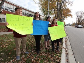 Students at Napanee District Secondary School stand in front of the school Thursday morning to protest the state of uncleanliness that has resulted from the walkout of support staff due to a Canadian Union of Public Employees job action. (Meghan Balogh/Postmedia Network)