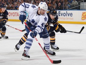 Maple Leafs forward Nazem Kadri carries the puck past Sabres’ Tyler Ennis on Wednesday night at the First Niagara Center in Buffalo. Kadri’s giveaway led to the tying goal for the hosts. (AFP/PHOTO)