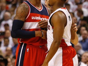 Toronto Raptors Kyle Lowry and Washington Wizards Bradley Beal bump chest in a heated moment during the NBA playoffs on April 21, 2015. (Jack Boland/Toronto Sun/Postmedia Network)