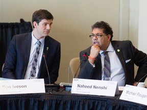 Calgary Mayor Naheed Nenshi (R) speaks beside Edmonton Mayor Don Iveson during the Canadian Federation of Municipalities "Big City Mayors" conference in Toronto, February 5, 2015.  REUTERS/Mark Blinch FILE PHOTO