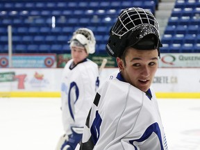 Zack Bowman, right, and Matthew Menna take part in a practice with the Sudbury Wolves at the Sudbury Community Centre in Sudbury, Ont. on Thursday October 22, 2015.