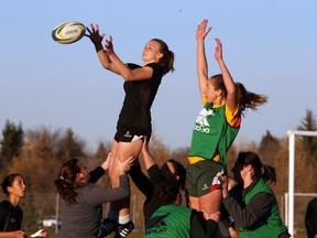 Alexa Martin catches the ball during the U of A Pandas Rugby team practice at Foote Field on Tuesday.  (Perry Mah, Edmonton Sun)