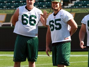 Edmonton Eskimos' Matthew O'Donnell (l) and Simeon Rottier during practice at Commonwealth Stadium in Edmonton, Alberta on Wednesday, September 5, 2013.  Perry Mah/Edmonton Sun/QMI Agency