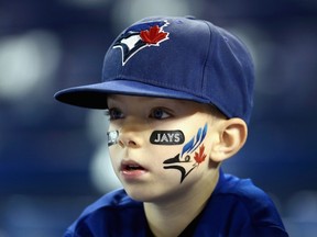 A young Toronto Blue Jays fan looks on prior to Game 5 of the ALCS between the Toronto Blue Jays and the Kansas City Royals at Rogers Centre in Toronto on Oct. 21, 2015. (Vaughn Ridley/Getty Images/AFP)