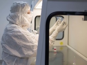 This photo courtesy of Joel Morillo of Passage Productions shows a technician inside Imprimis Pharmaceuticals in Irvine, Calif. Imprimis Pharmaceuticals Inc., which mixes approved drug ingredients to fill individual patient prescriptions, said Oct. 22, 2015,  it will supply capsules containing Daraprim’s active ingredients, pyrimethamine and leucovorin, for $99 for a 100-capsule bottle. (Courtesy of Joel Morillo of Passage Productions via AP)