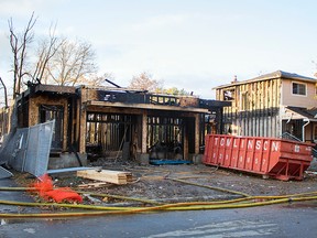 Firefighters battled a blaze at 228 Glynn Ave. in the city's east end in Overbrook early Friday Oct. 23, 2015. The home was under construction and the two neighbouring residences were damaged.(DANI-ELLE DUBE/OTTAWA SUN)