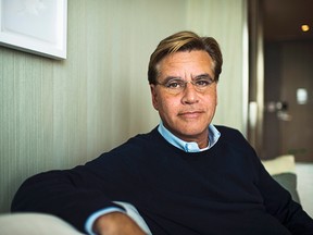 In this Oct. 20, 2015 photo, screenwriter Aaron Sorkin poses for a photo while promoting his new movie "Steve Jobs," in Toronto. (Aaron Vincent Elkaim/The Canadian Press)