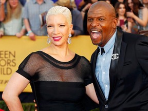 Actor Terry Crews from the FOX series "Brookyn Nine-Nine" and his wife, Rebecca, arrive at the 21st annual Screen Actors Guild Awards in Los Angeles, California January 25, 2015.  REUTERS/Mike Blake