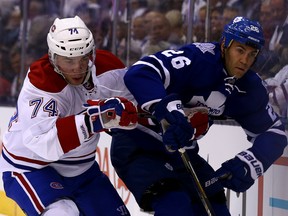 Daniel Winnik of the Toronto Maple Leafs battles for position against Alexei Emelin of the Montreal Canadiens during NHL action at the Air Canda Centre in Toronto on Wednesday October 7, 2015. Dave Abel/Toronto Sun/Postmedia Network
