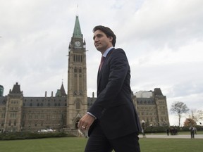 Prime minister designate Justin Trudeau walks to a news conference from Parliament Hill in Ottawa, Tuesday Oct. 20, 2015. (THE CANADIAN PRESS/Adrian Wyld)