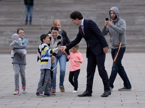 Prime minister-designate Justin Trudeau makes his way from Parliament Hill to the National Press Theatre to hold a press conference in Ottawa on Tuesday, October 20, 2015. THE CANADIAN PRESS/Sean Kilpatrick
